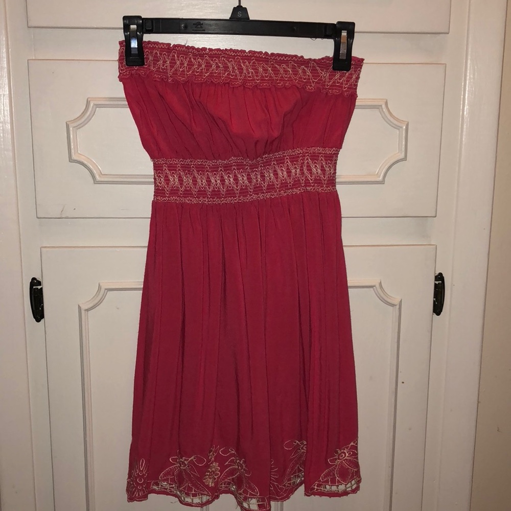 Pink strapless dress with floral pattern.